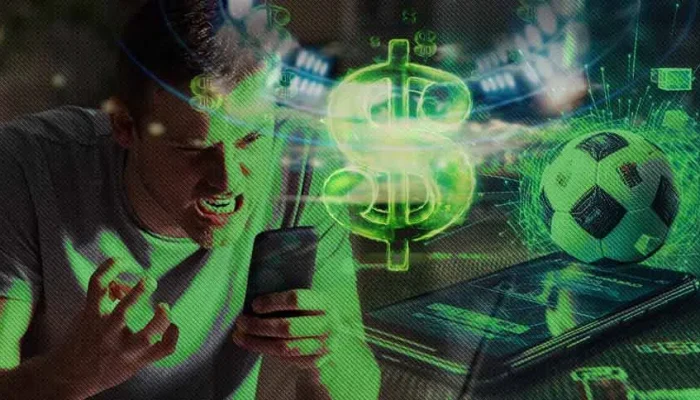 Homem expressando frustração ao olhar para o celular com ícone de dólar e bola de futebol sobrepostos